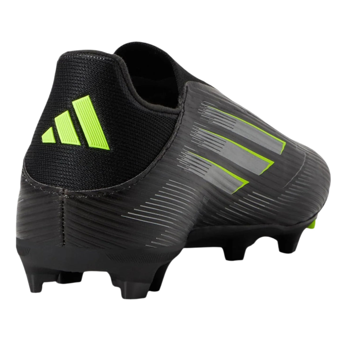 Black soccer cleat with green accents on a white background