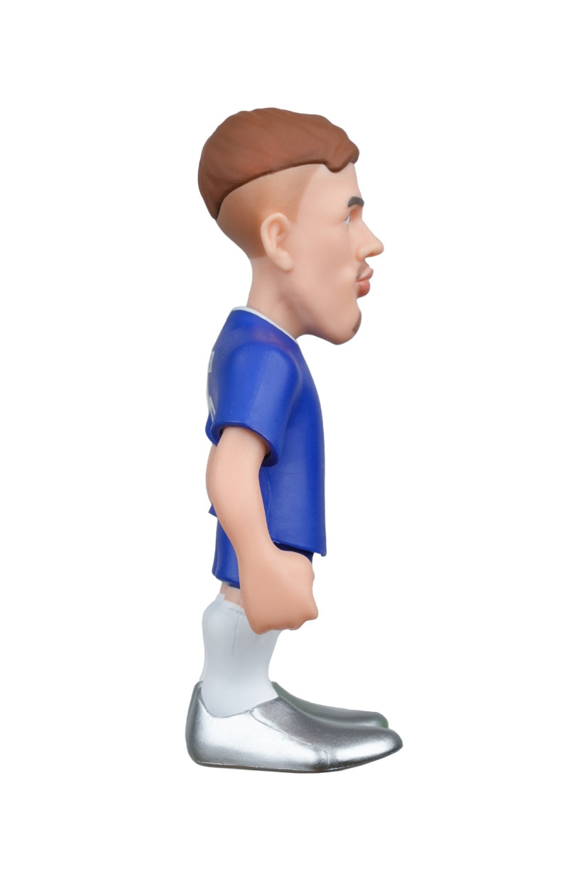 Figurine of a soccer player in a blue jersey with a white logo on a white background