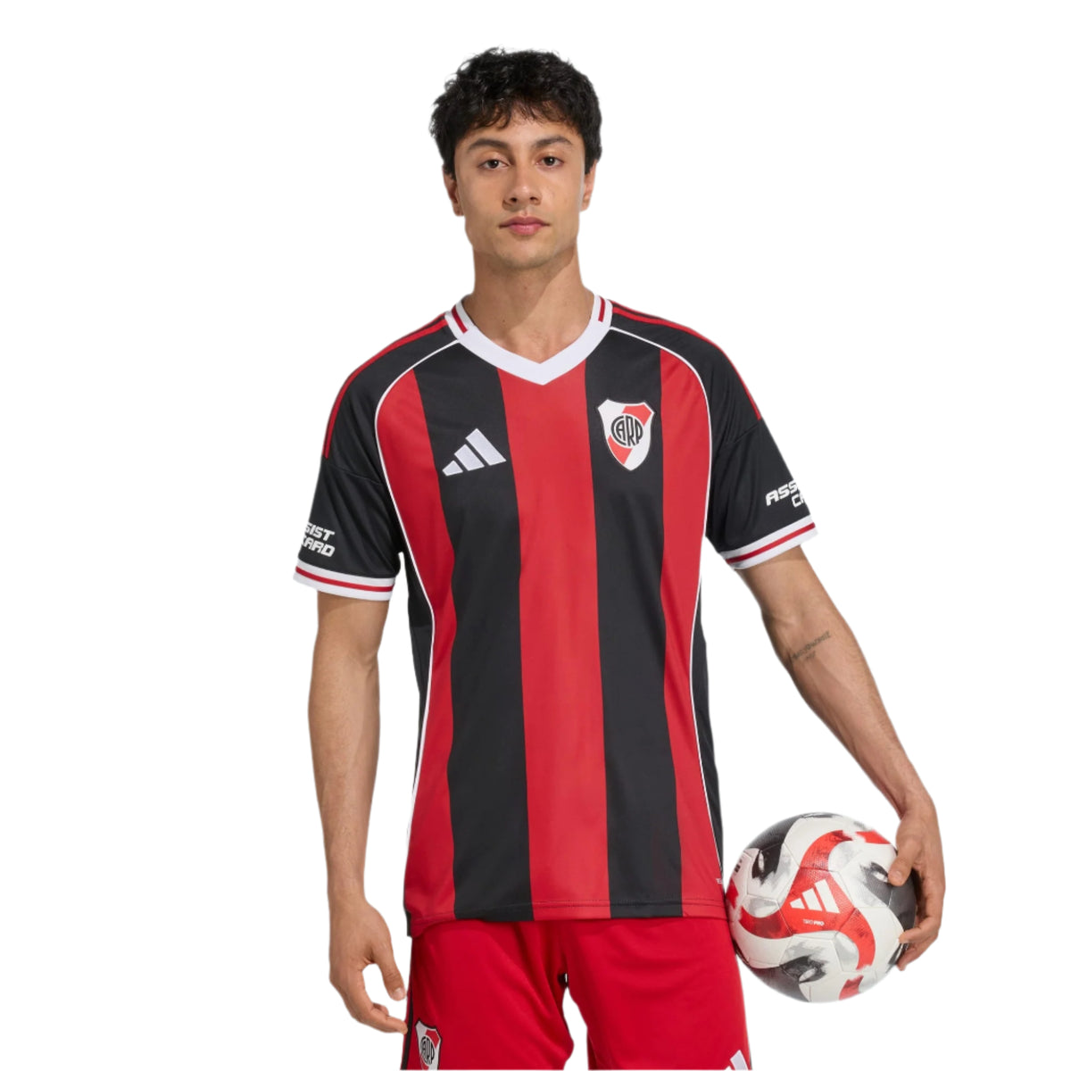 Person wearing a red and black striped sports jersey holding a soccer ball on a white background